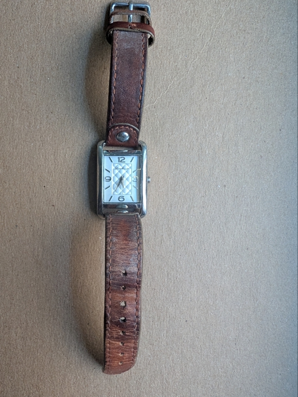 Eddie Bauer rectangular women's watch, silver-tone case with Leather Strap.